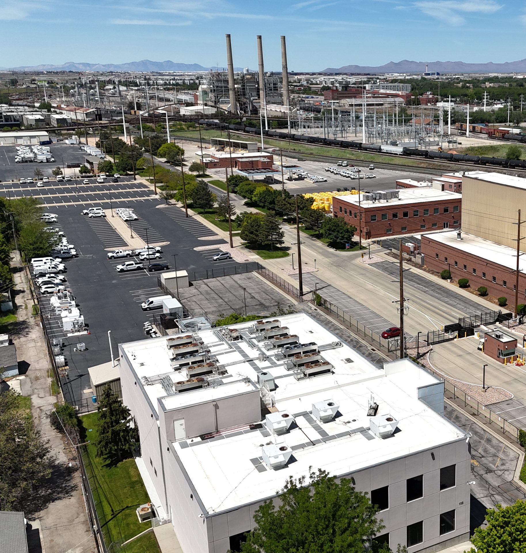 In the foreground, a two-story white building houses a datacenter. There are some coolers on the roof, but not a lot. In the distance is the Gadsen Power Station; the most prominent factor being three smokestacks. The actual gas turbines are behind the stacks.
