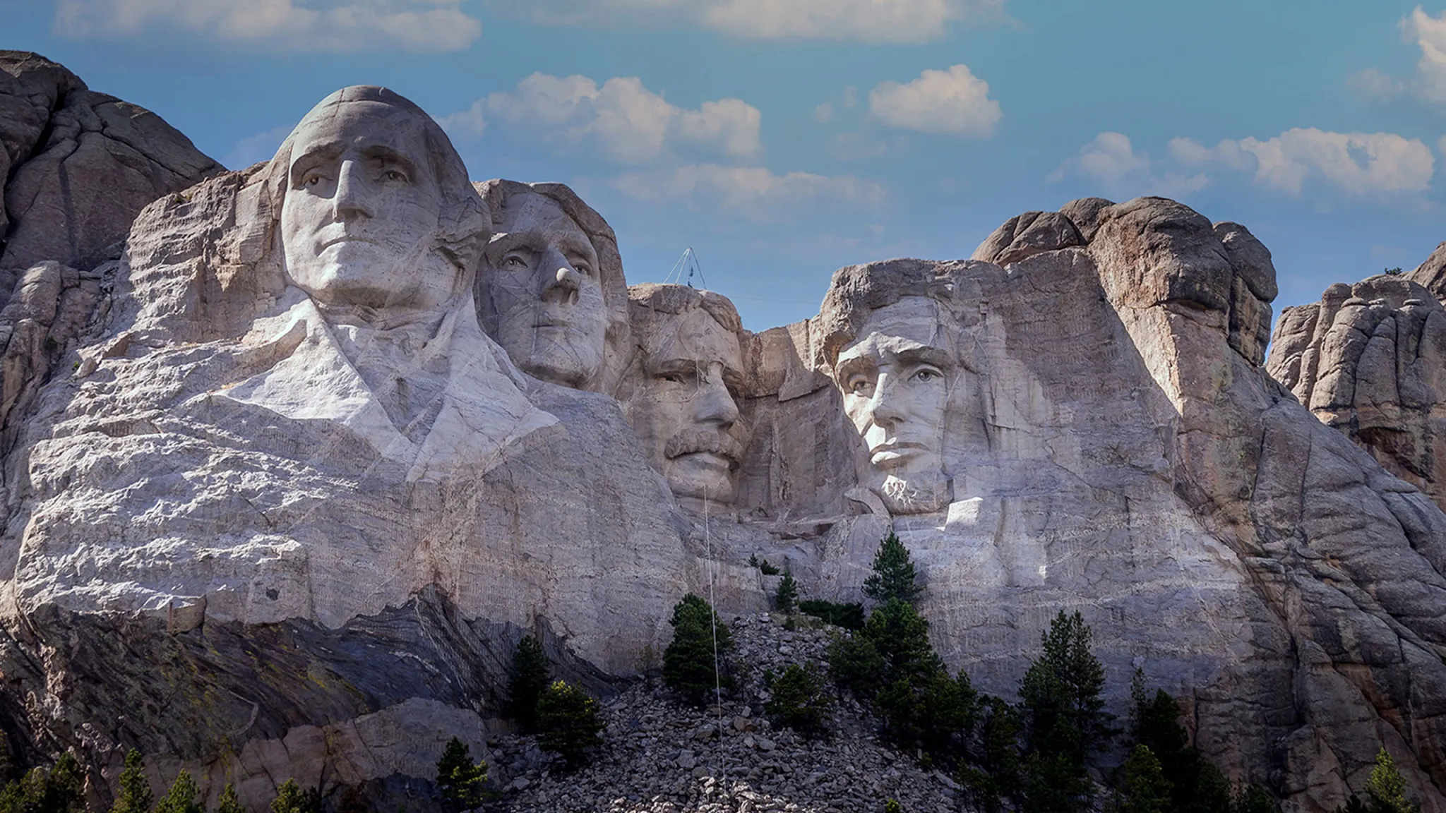 Dead fuckin' Presidents, baby. The faces of (from left to right) George Washington, Thomas Jefferson, Theodore Roosevelt, and Abraham Lincoln have been blasted in terrifying size into the face of Mount Rushmore's granite. It was meant to be faces and torsos, but the project was never completed.