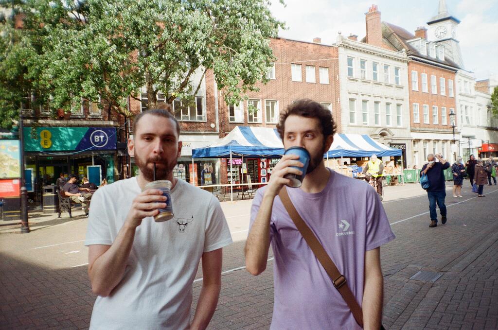 Two guys enjoying their first coffees since COVID-19 Lockdown lifted