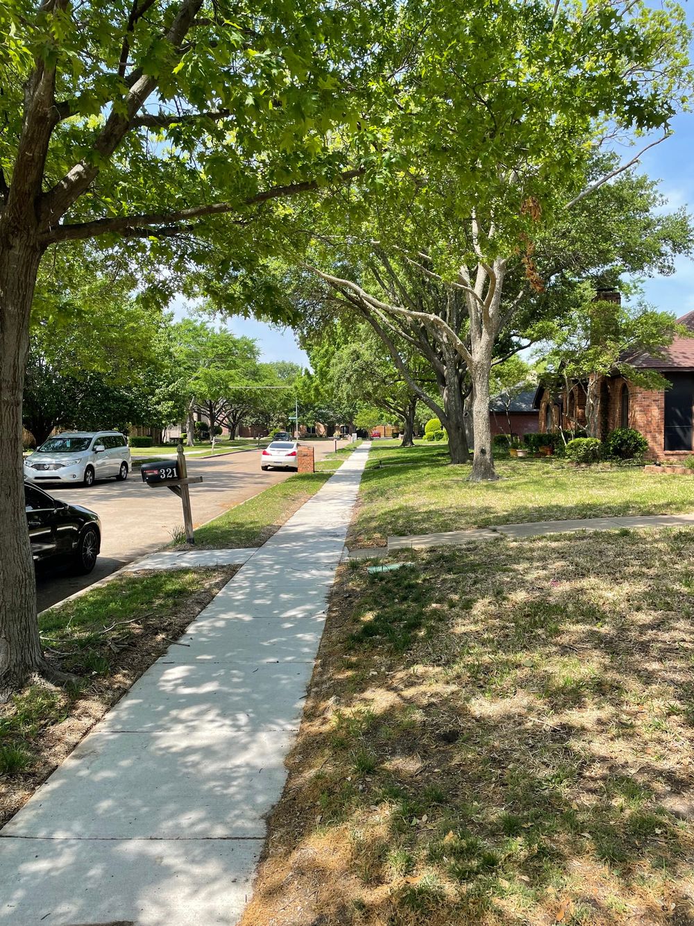 View of a front porch and a driveway