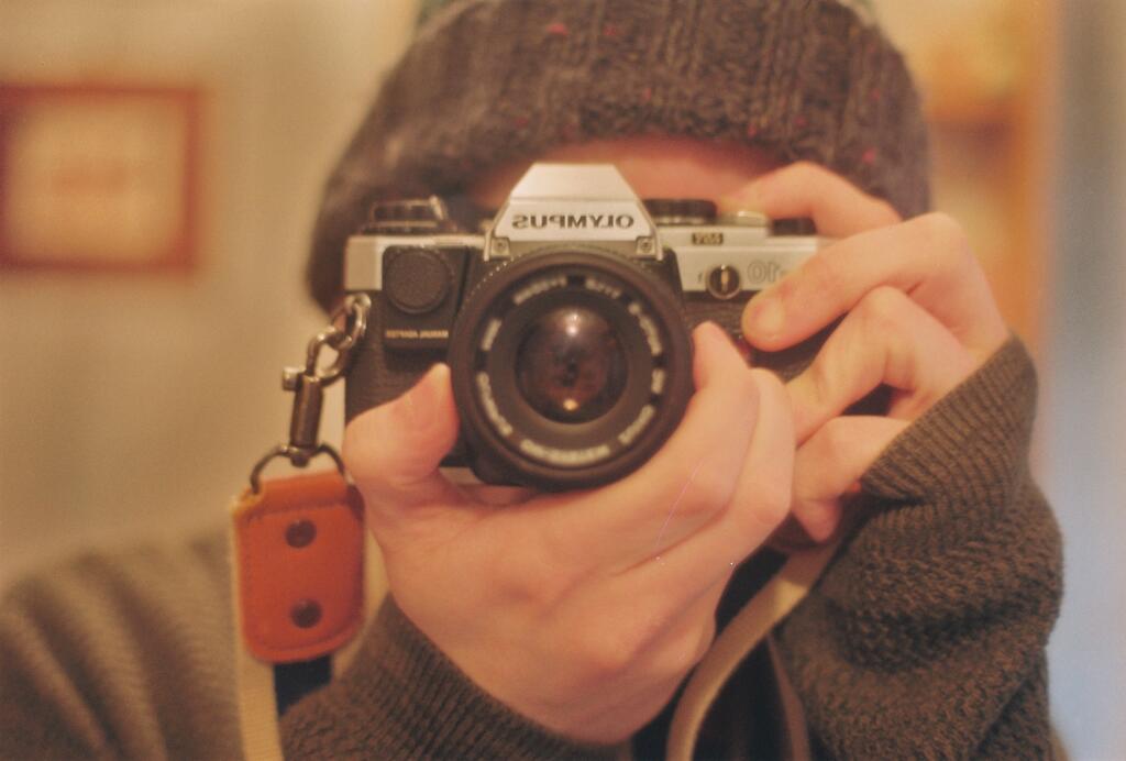 A selfie of me shot in a mirror on film using my Olympus OM10