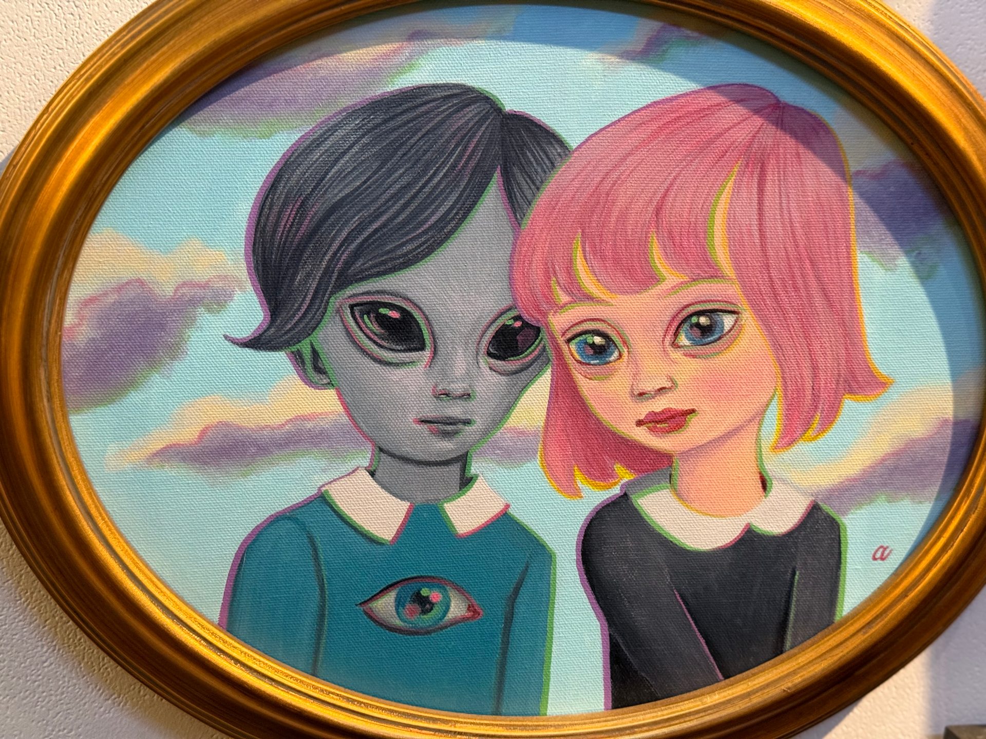 an alien boy and a human girl. i think they're in love, but the placard says they're friends.