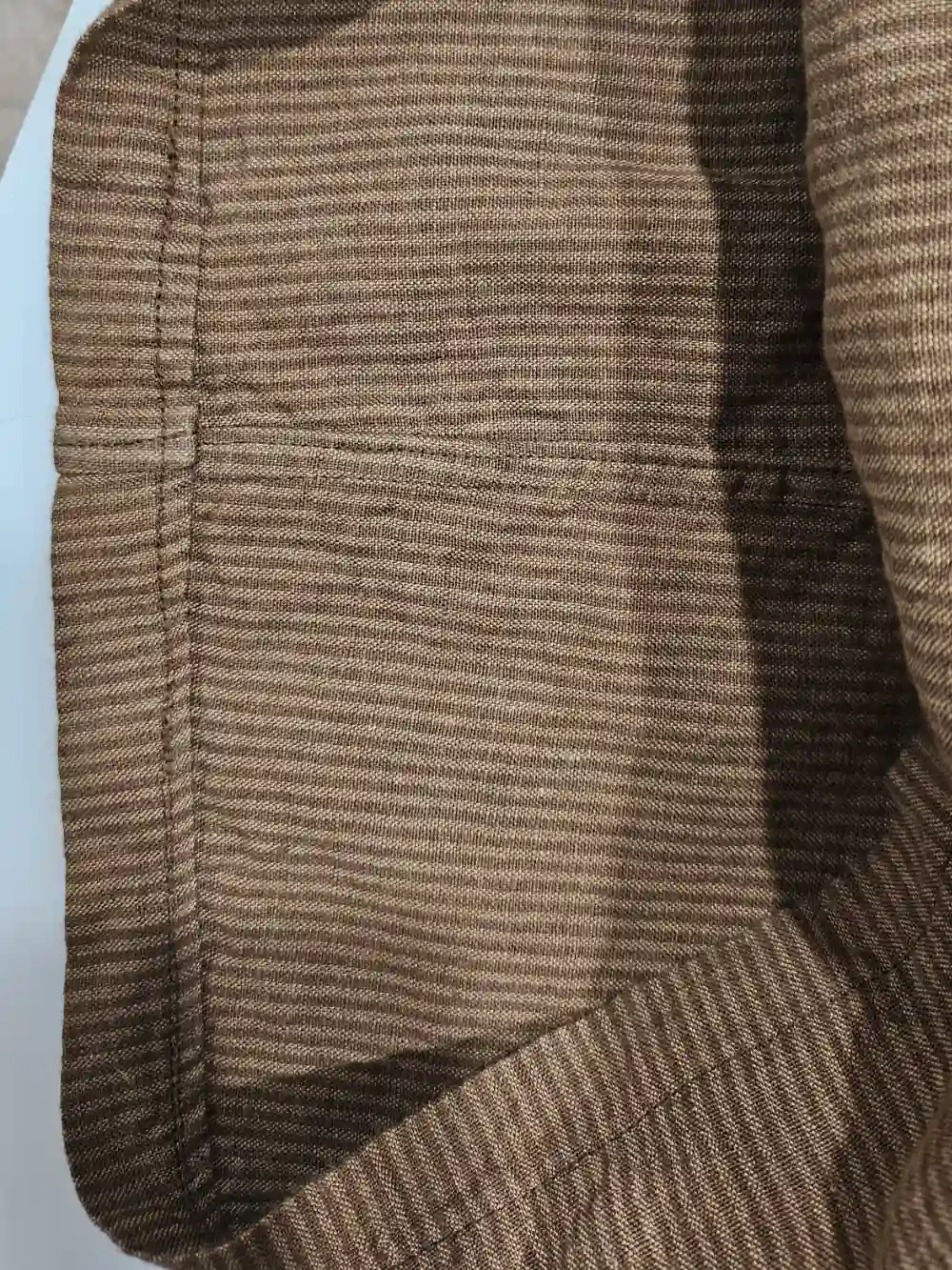 The inside cuff shows finished seams.