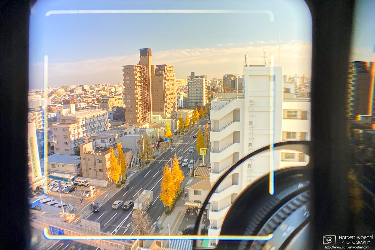 View through the Mamiya 6 viewfinder (with framelines for 50mm lens) - the scenery is a southbound view from my apartment in Tokyo in 2020.