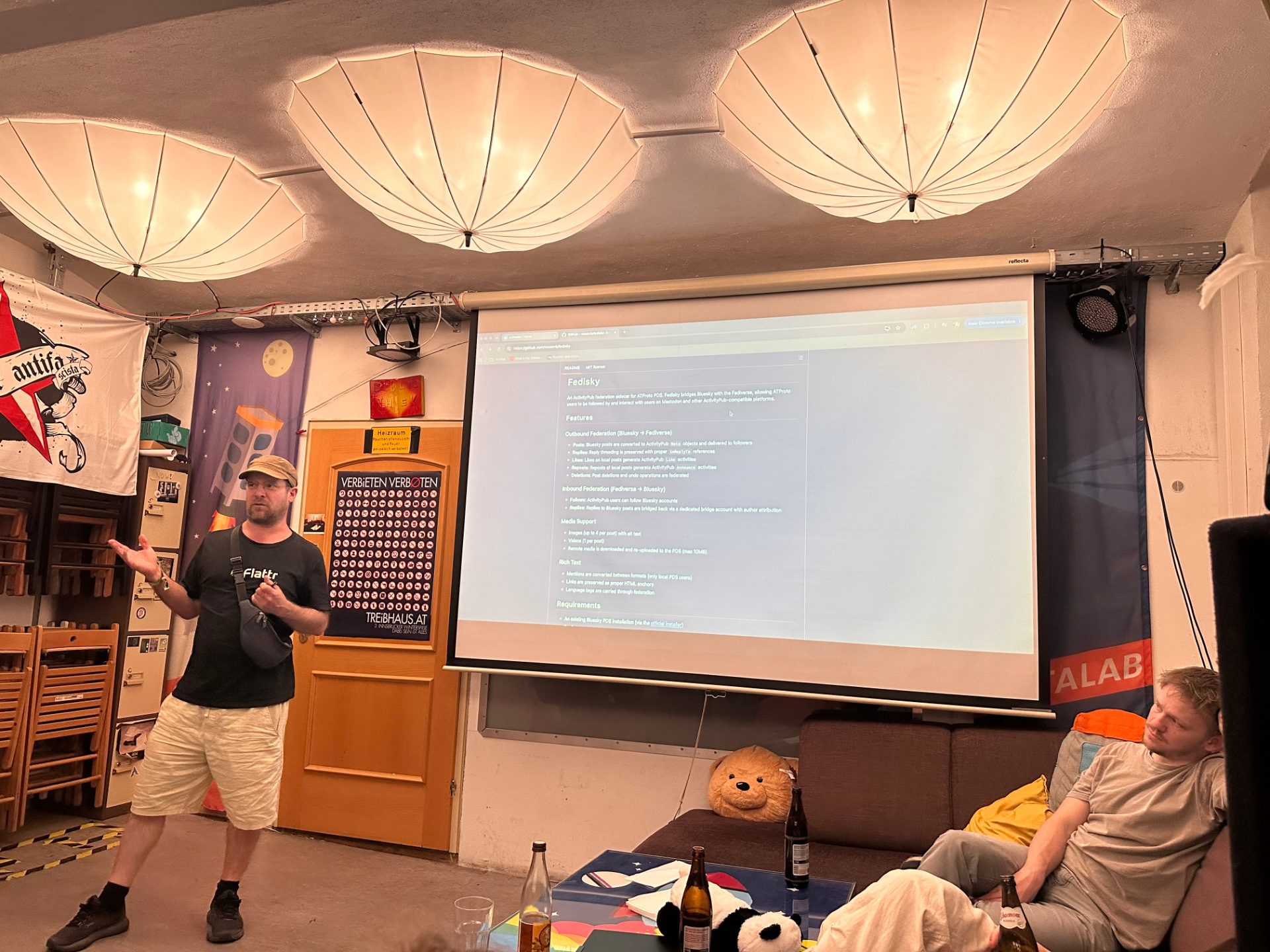 Paul presenting the Fedisky project with the screen showing its GitHub readme page.