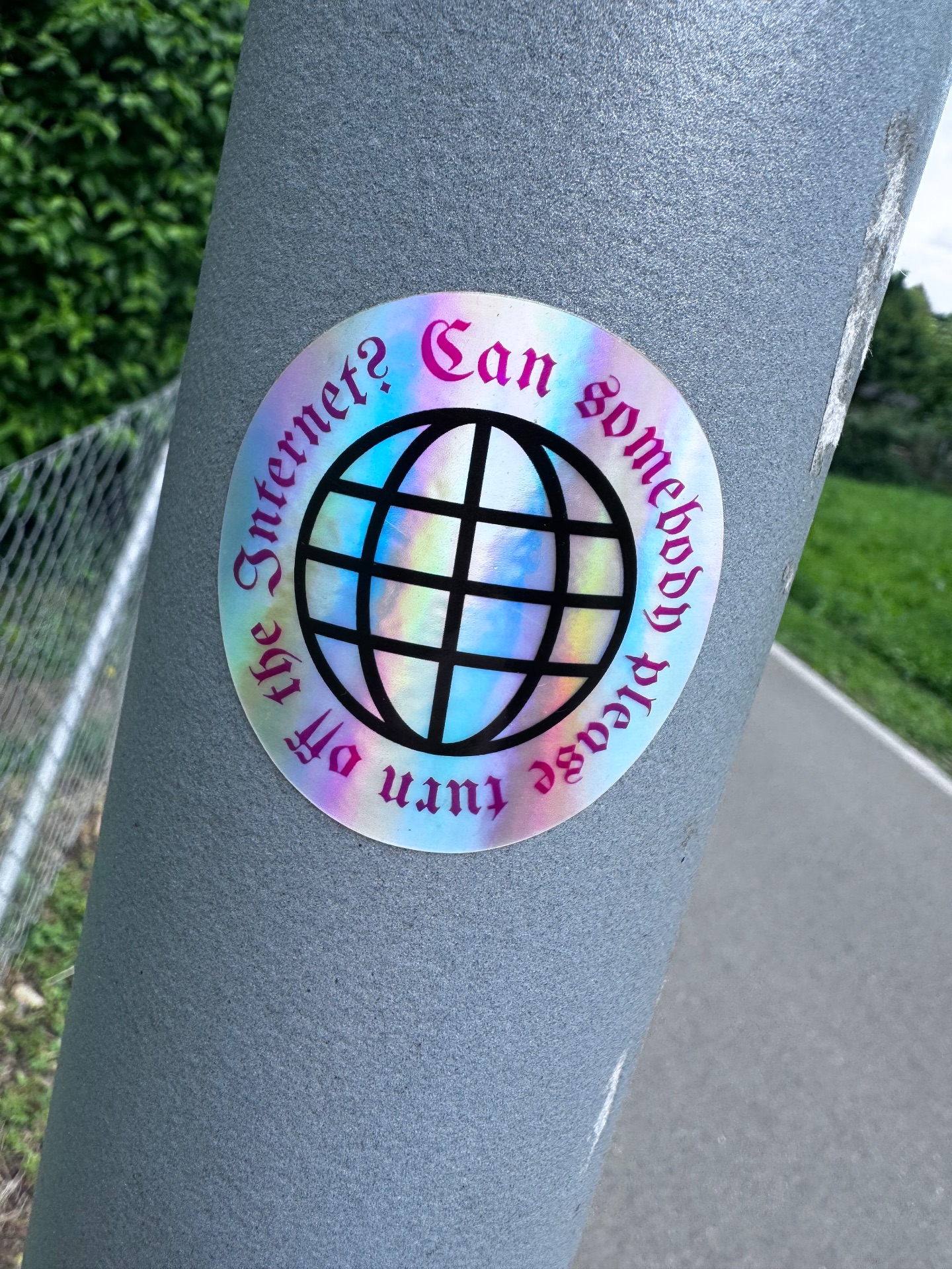 Sticker with a globe on it encircled by the text could someone please turn off the internet”