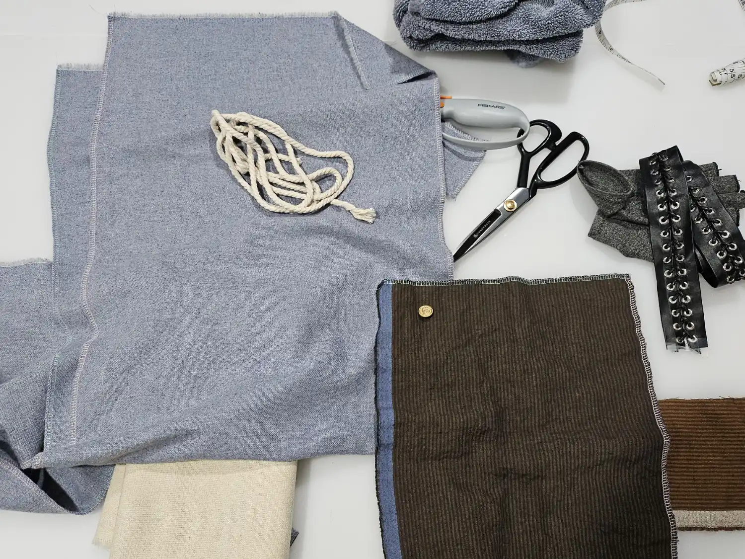 Blue-dyed linens lay against the undyed versions of the fabric.