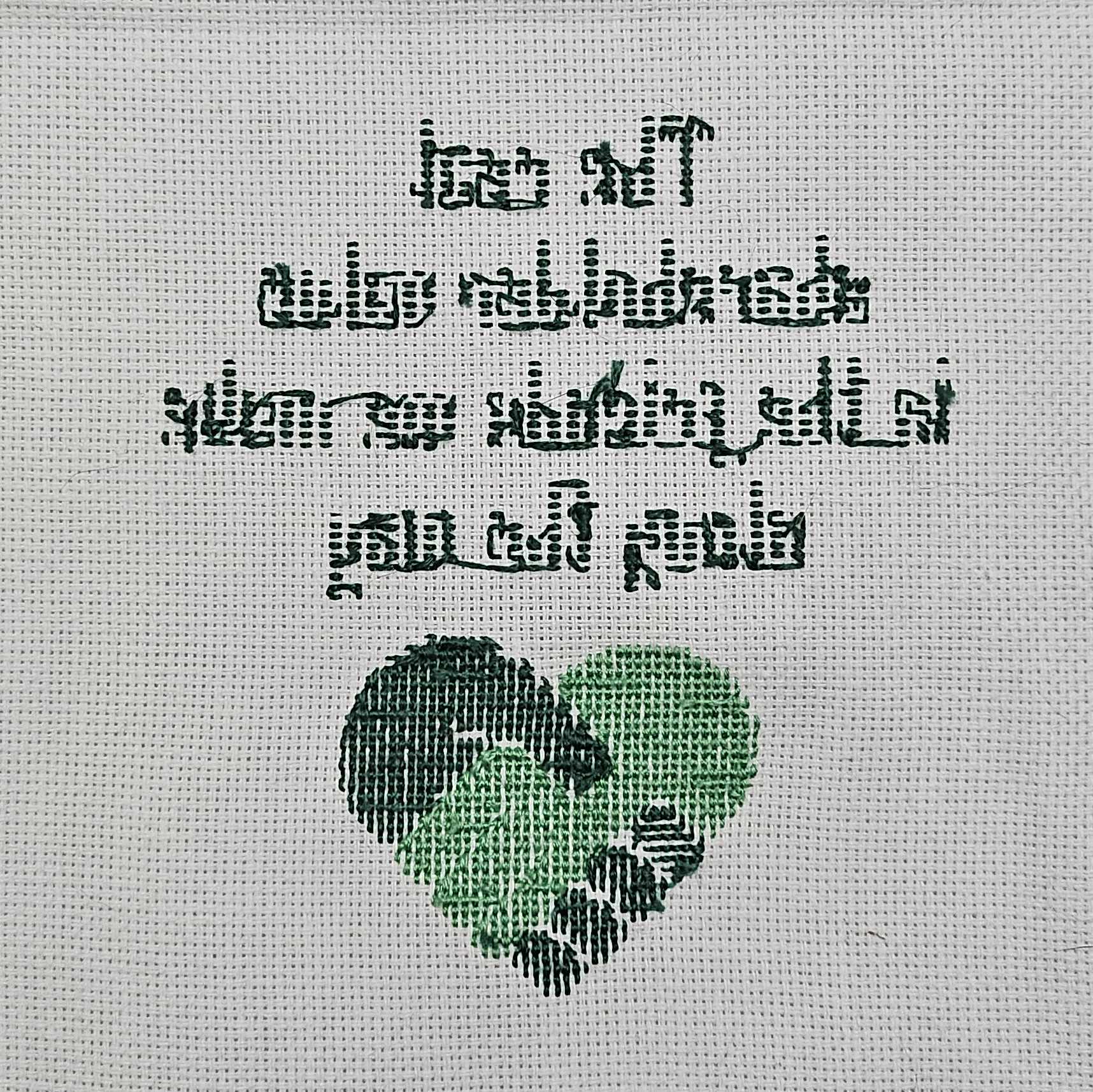 The back-side of the cross-stitch. It's relatively neat.
