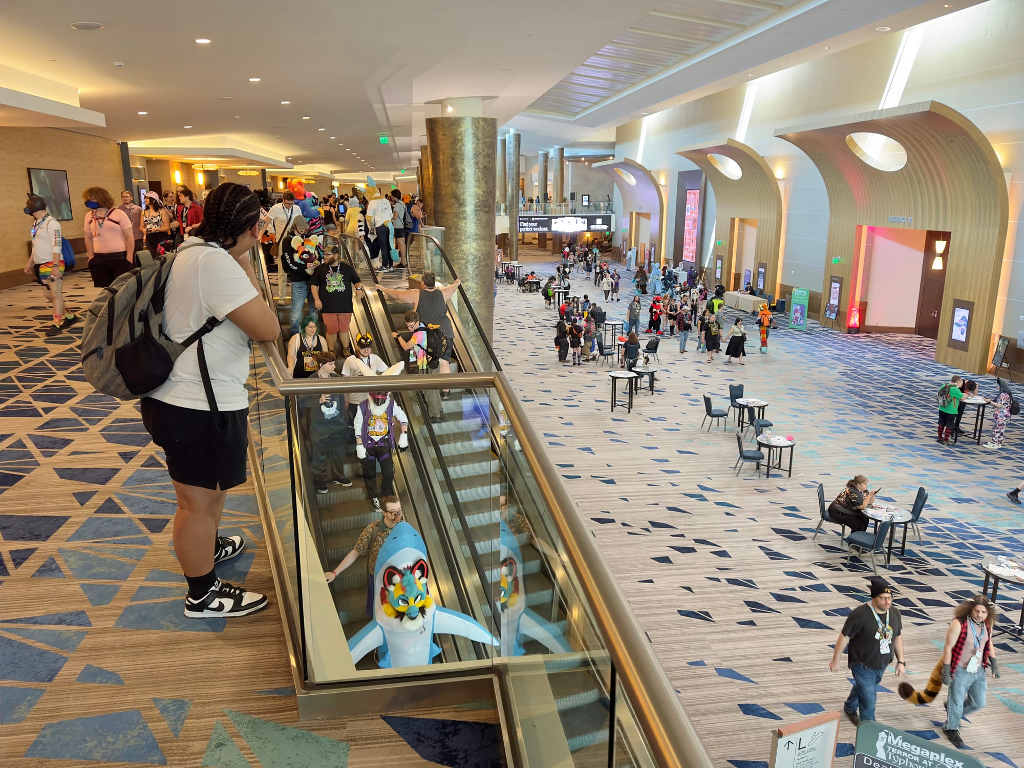 Escalators between the convention area floors near the dealer's den.