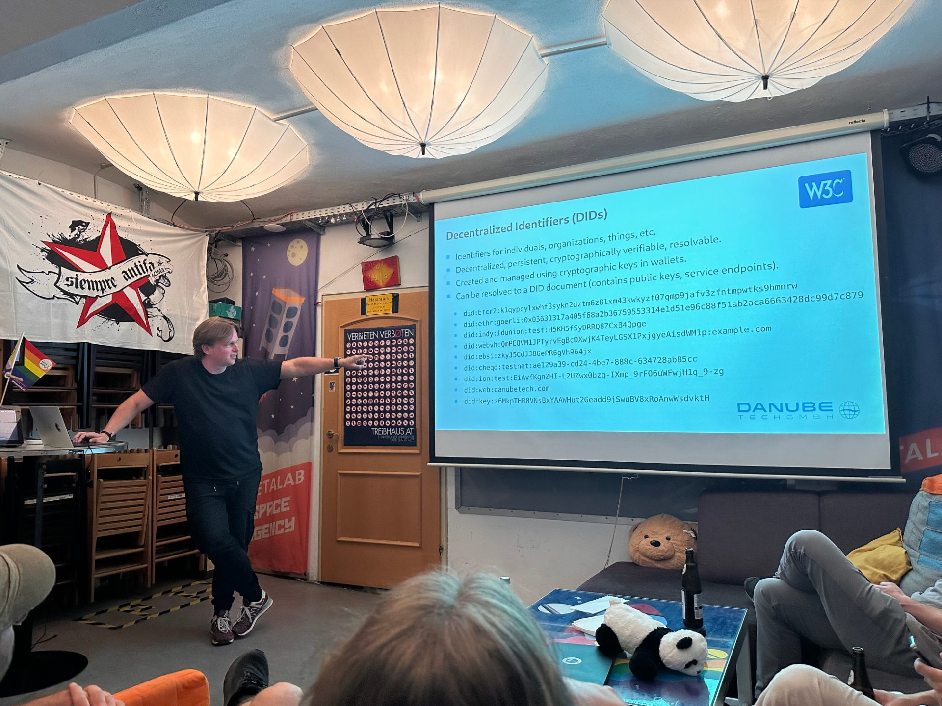 Markus is presenting about digital identities and their use in atproto in front of a slide detailing a number of various did types.