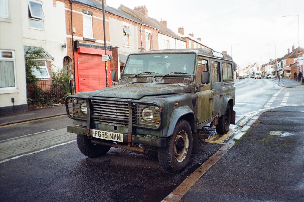 An old Land Rover parked on a street
