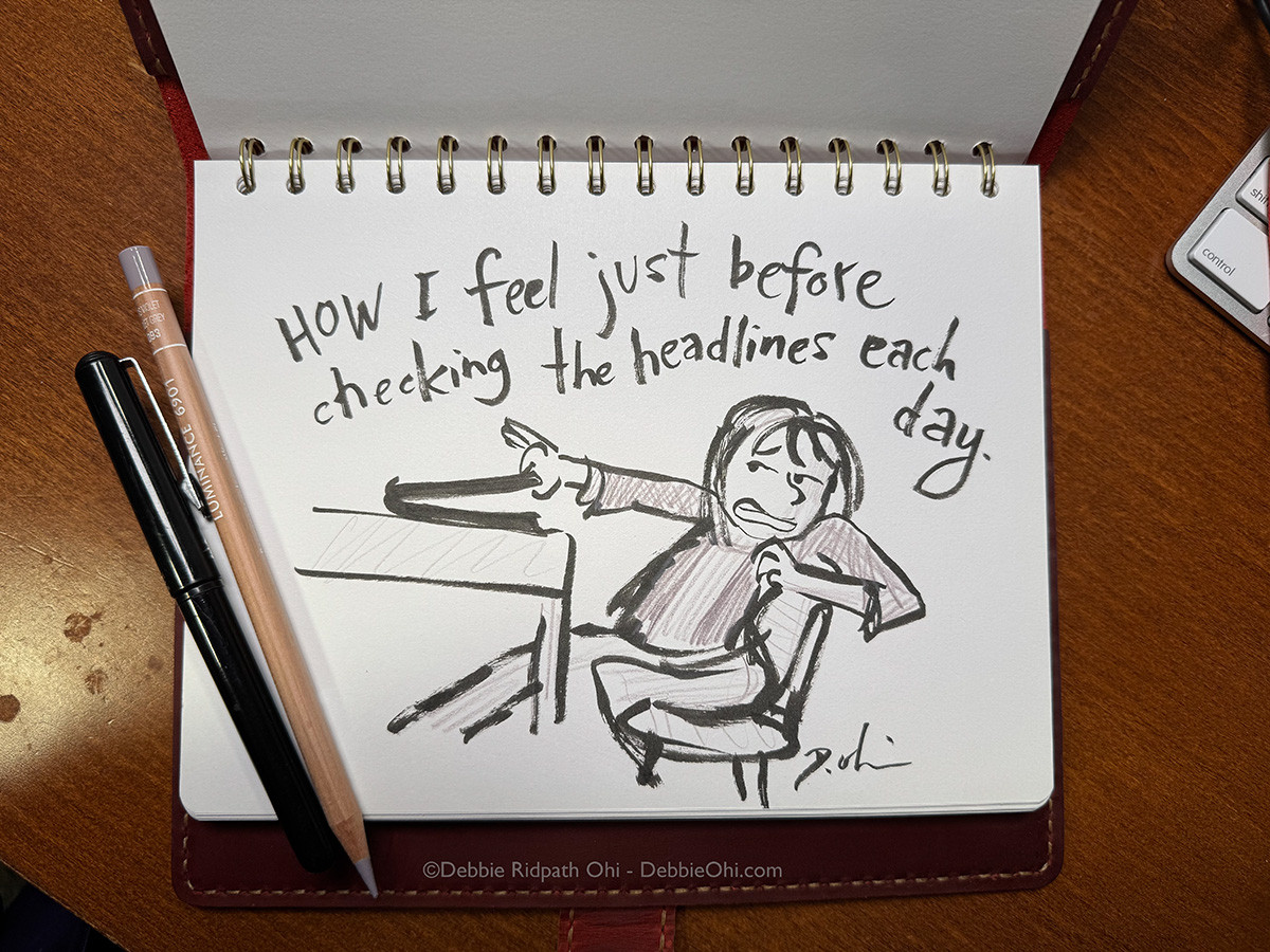 Sketch in a spiral-bound notebook showing a person cowering or bracing themselves while sitting at a desk, with handwritten text that reads "HOW I feel just before checking the headlines each day." Copyright credit visible at the bottom reads "©Debbie Ridpath Ohi - DebbieOhi.com".