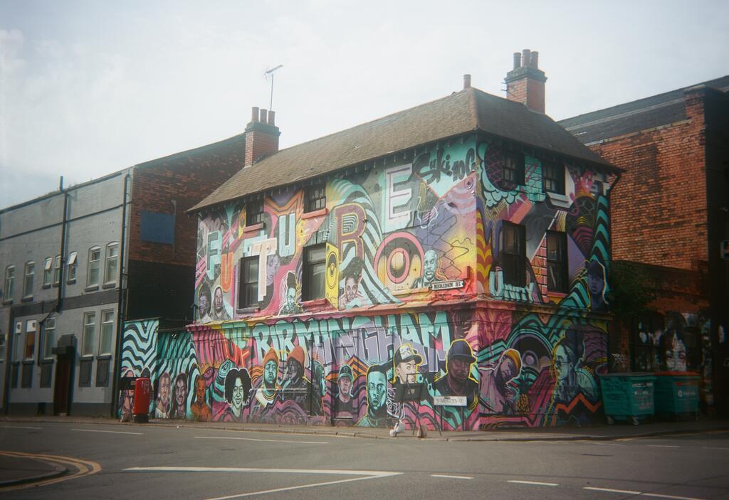 A building covered in graffiti shot on Film Photography Project 620 film