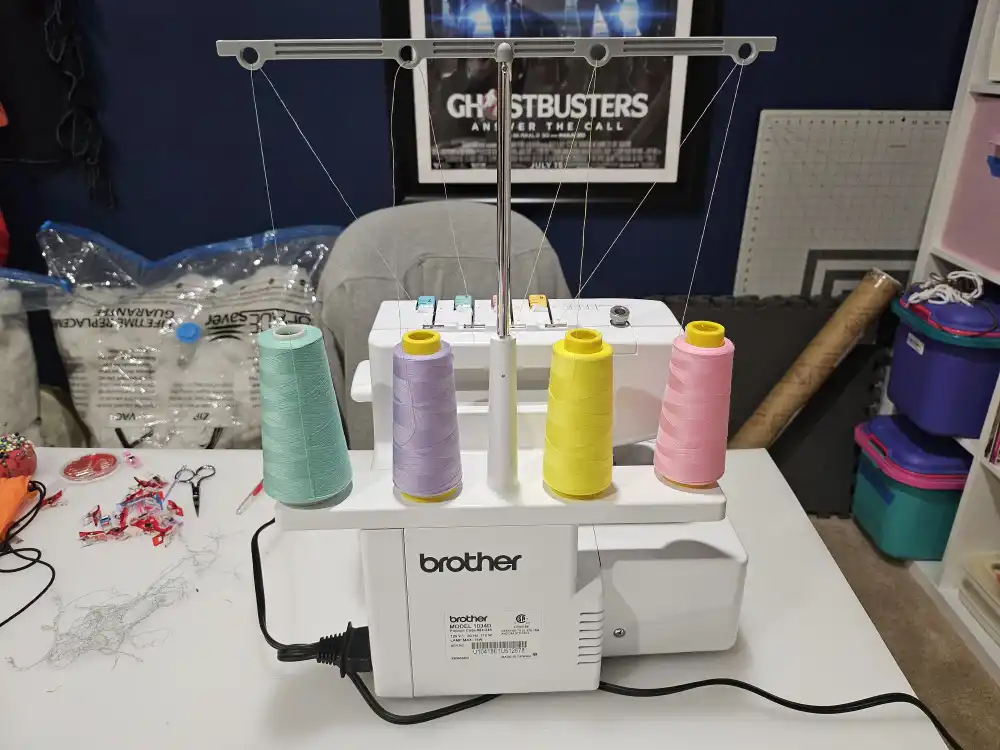 A serger is set up with pastel colored thread.