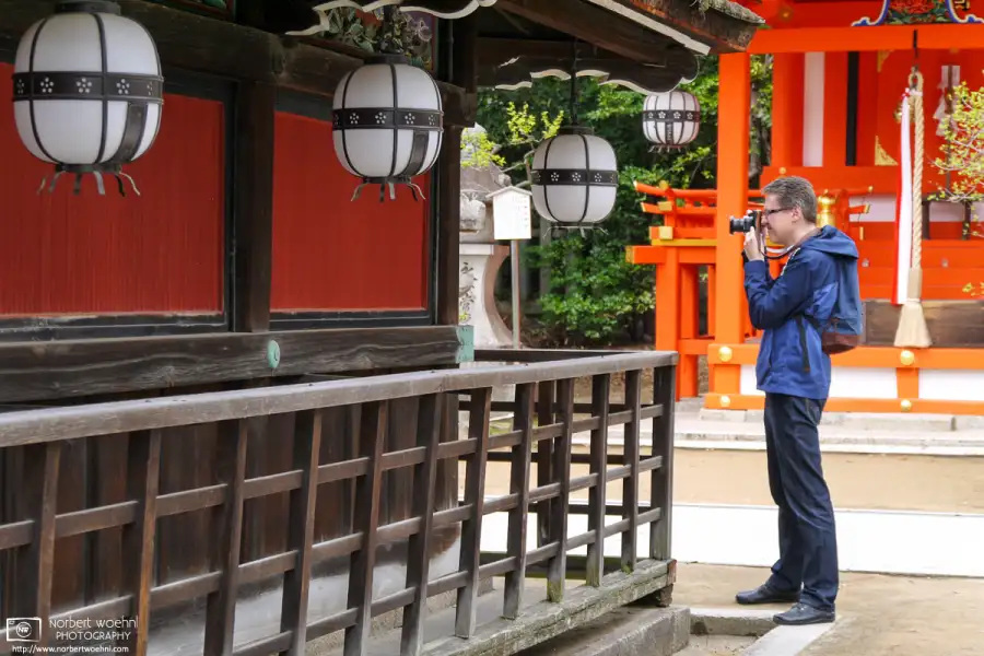 A photo of me in 2016 taking pictures with the Mamiya 6 at Kitano Tenmangu Shrine in Kyoto, Japan.