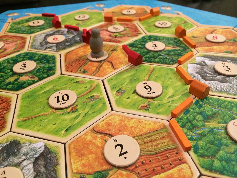 a photo of the board game "Settlers of Catan" taken by Via Tsuji
source: https://flic.kr/p/neRgV7